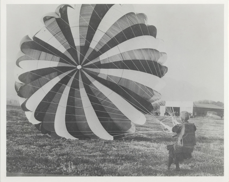 A picture of the first landing Tiny Broadwick made from an airplane at Griffith Park, June 21, 1913. Note written on the back reads, "This picture was taken in action and was a stand up landing."