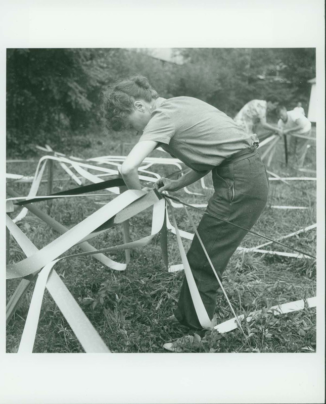 Elaine de Kooning working on the Venetian Blind Strip Dome (also known as the Supine Dome) which was created as part of Buckminster Fuller's Architecture Class, 1948 Summer Session in the Arts. Photographer: Trude Guermonprez.